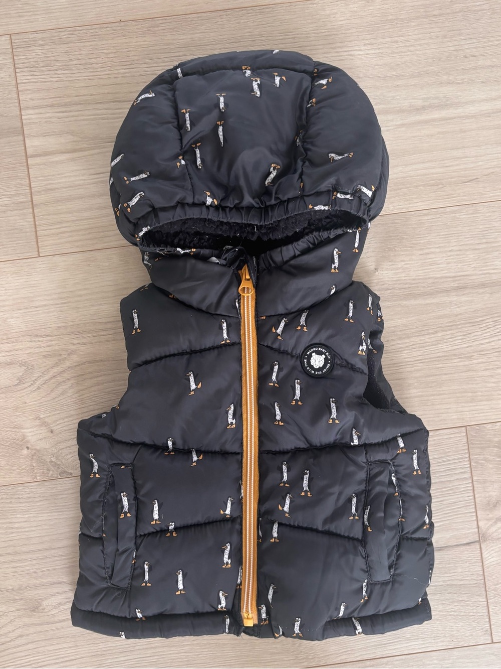 Kids puffer vest with penguin detail